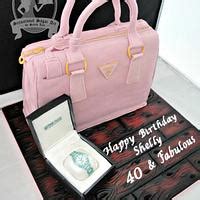 Prada Handbag and Tag Heuer cake .